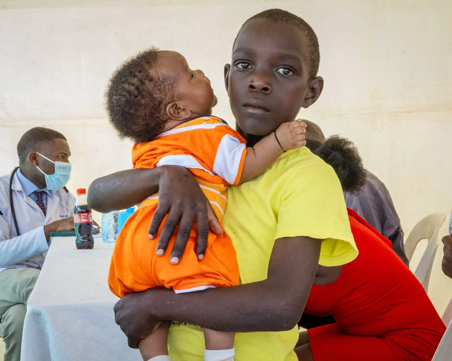 A young mother holding her child