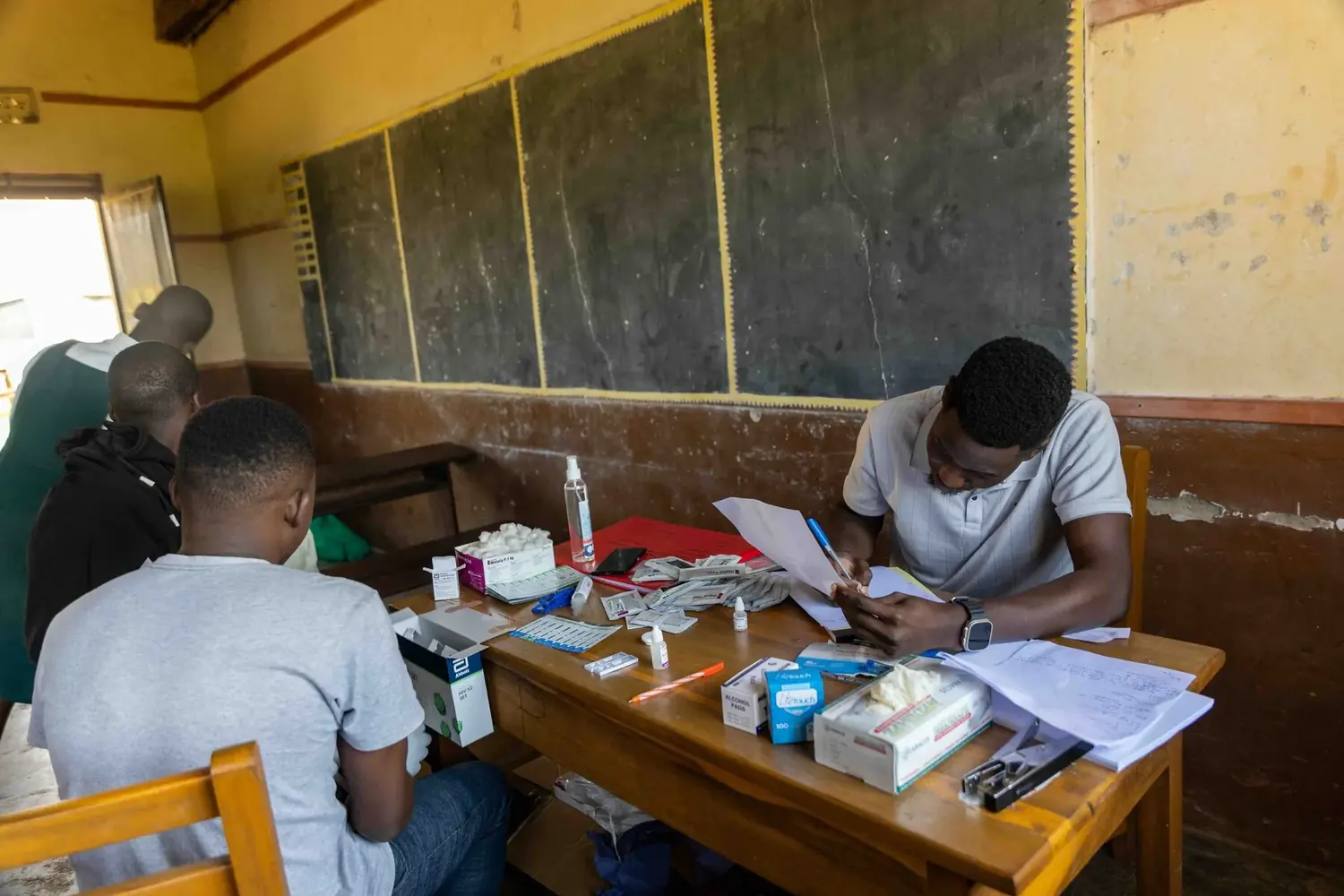 Partners and volunteers working together at a camp